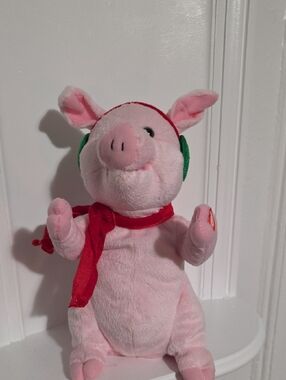 Hallmark animated plush Christmas pig that dances and squeals to "Jingle Bells".